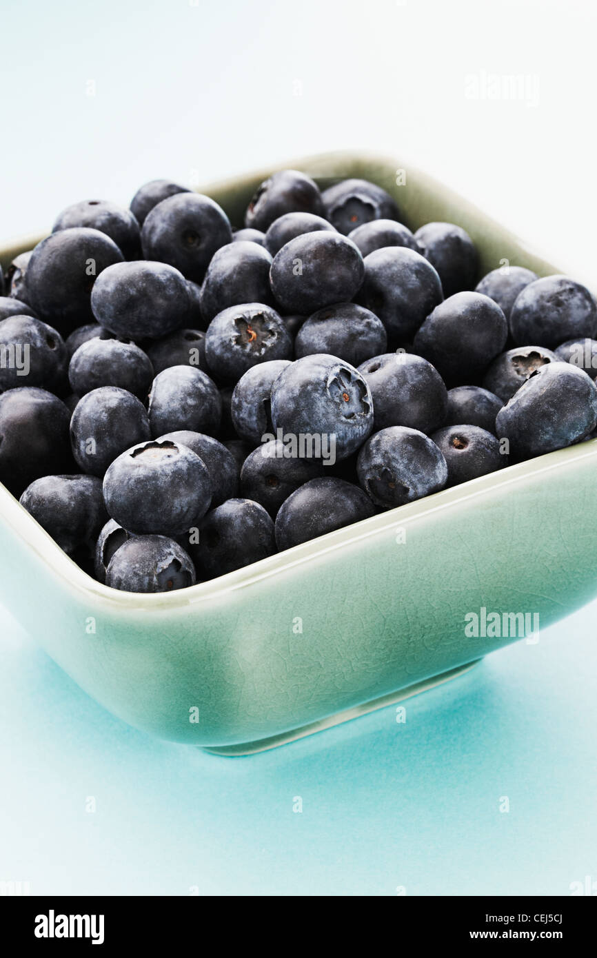 Close up of Blueberries in a green bowl Stock Photo