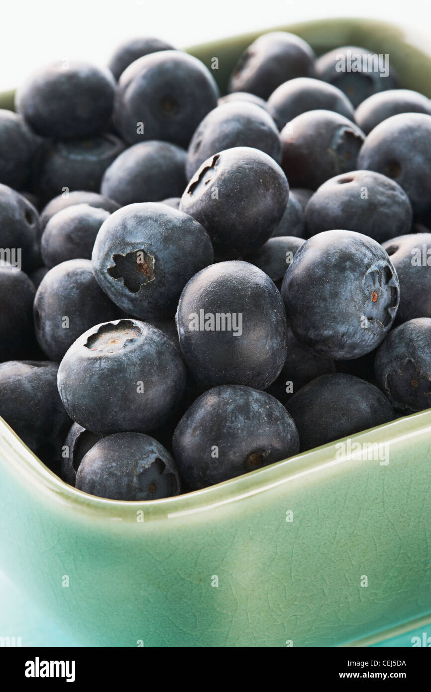 Close up of Blueberries in a green bowl Stock Photo