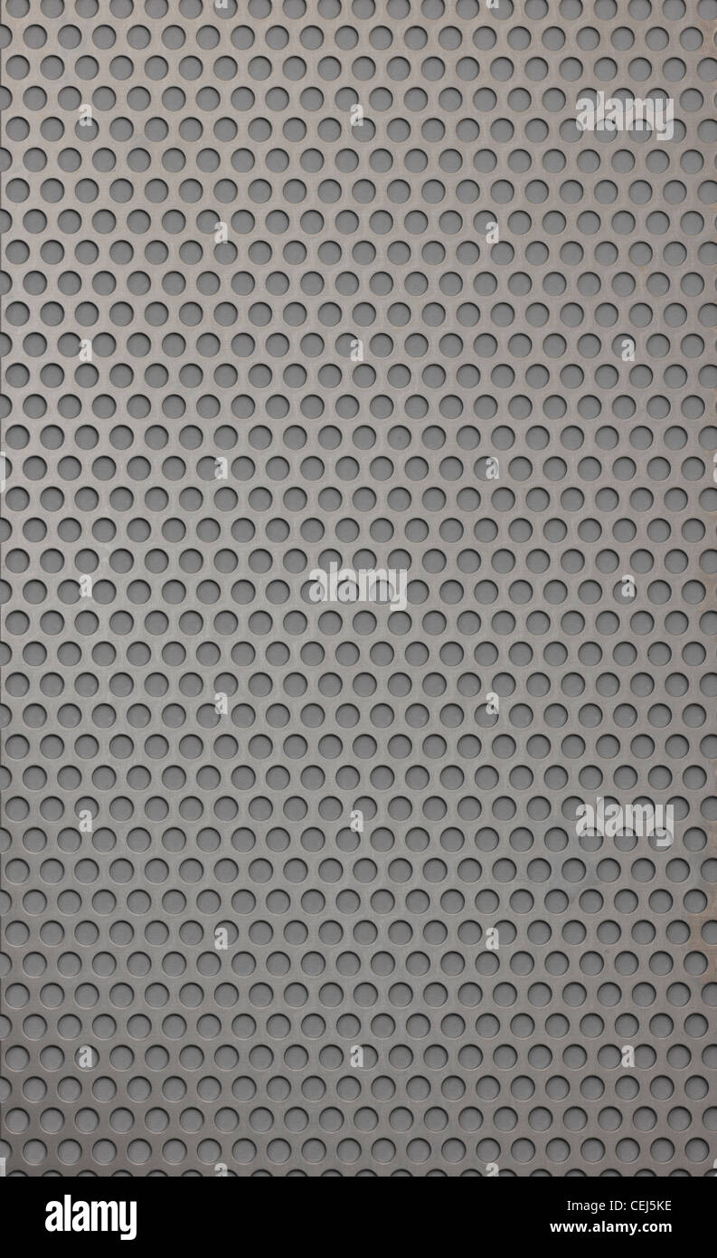 Metal textured background with holes drilled in Stock Photo - Alamy