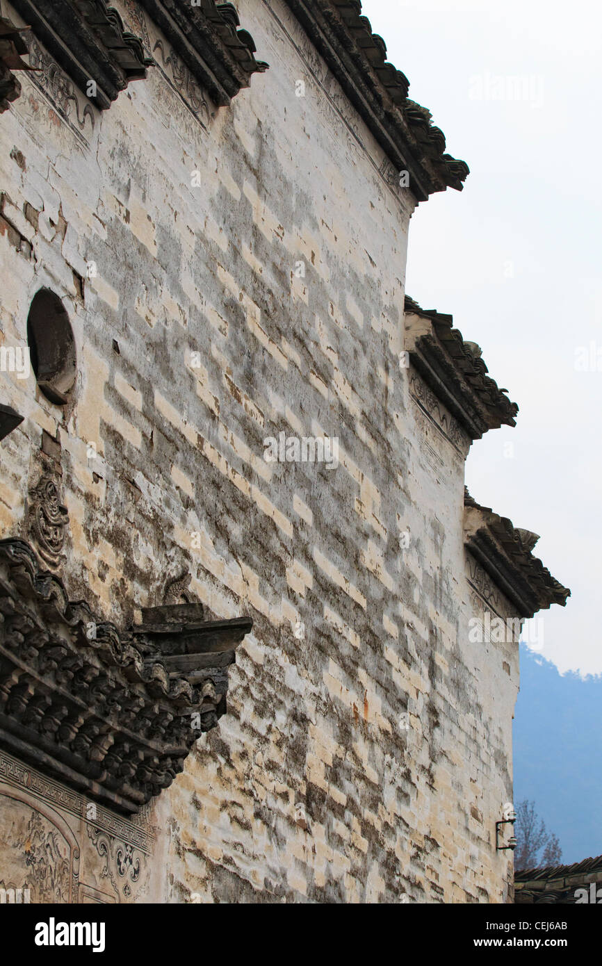 A Chinese hui style house, high white textured wall and black roof with tiered design Stock Photo