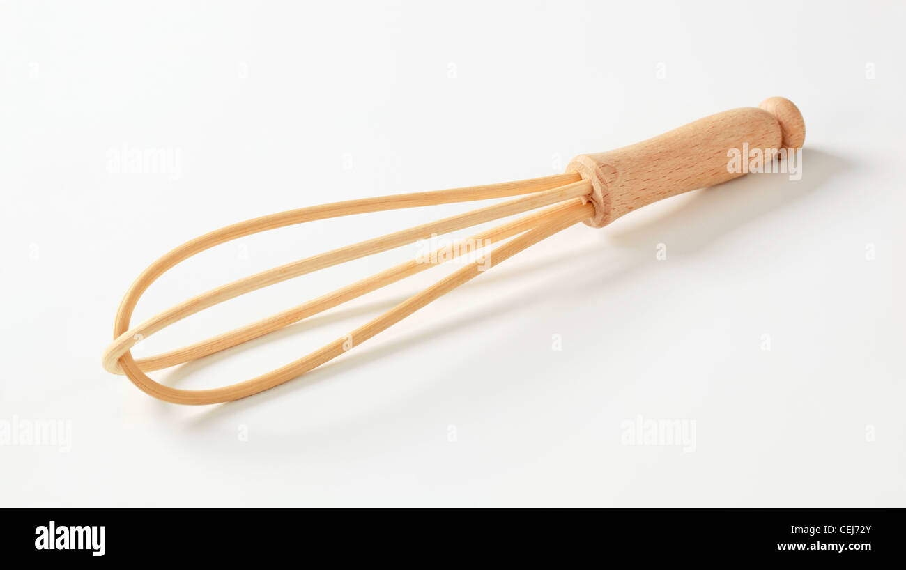 Closeup of wooden cooking whisk - studio Stock Photo