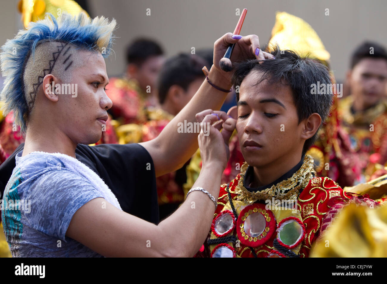 final touches are applied by beautician before the Sinulog Grande Parade 2012 Stock Photo