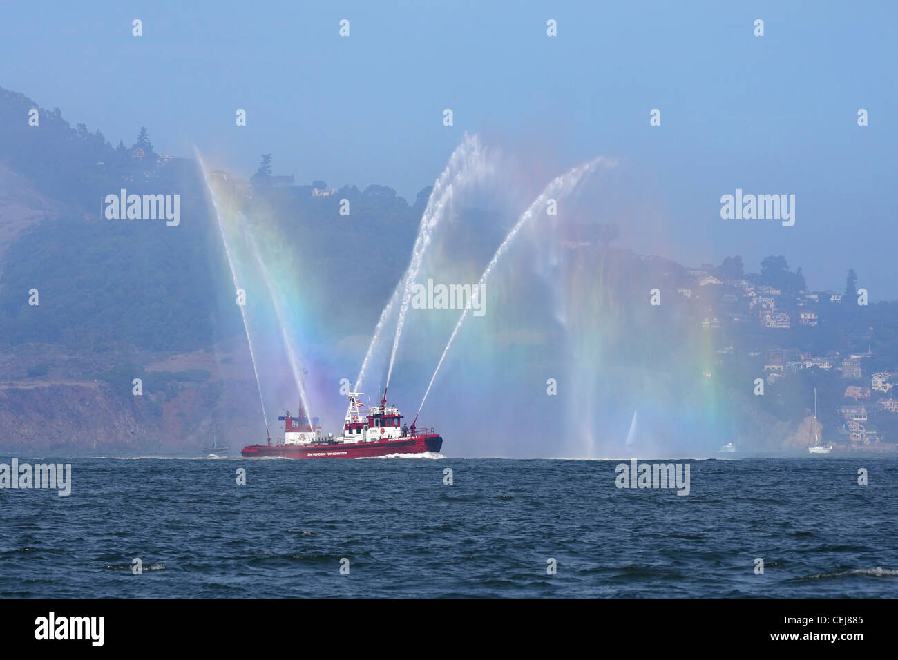 San Francisco Fire Department Fireboat Guardian creates a rainbow on San Francisco Bay. Stock Photo