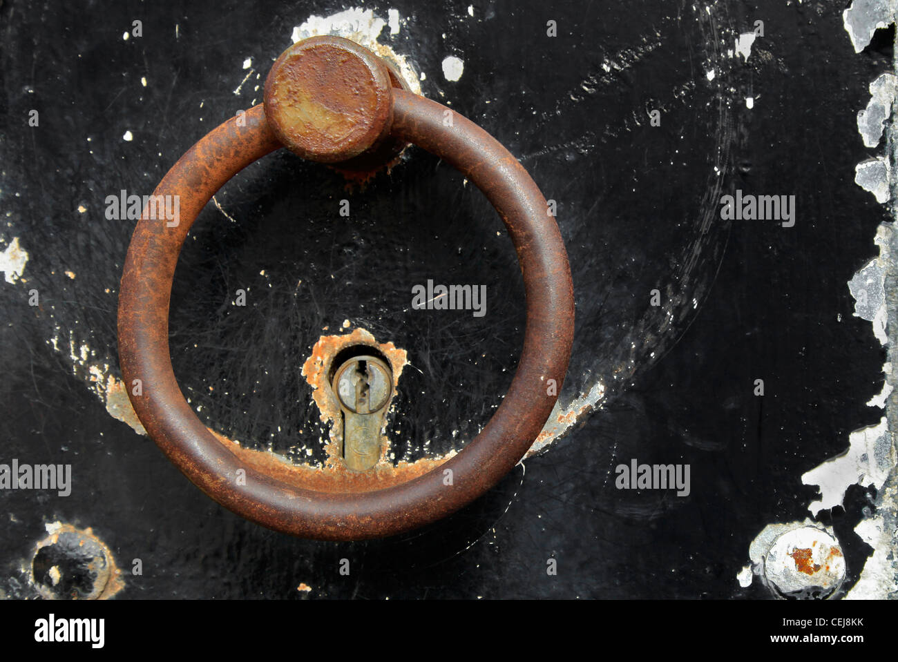 Old ring-shaped door knocker. Stock Photo