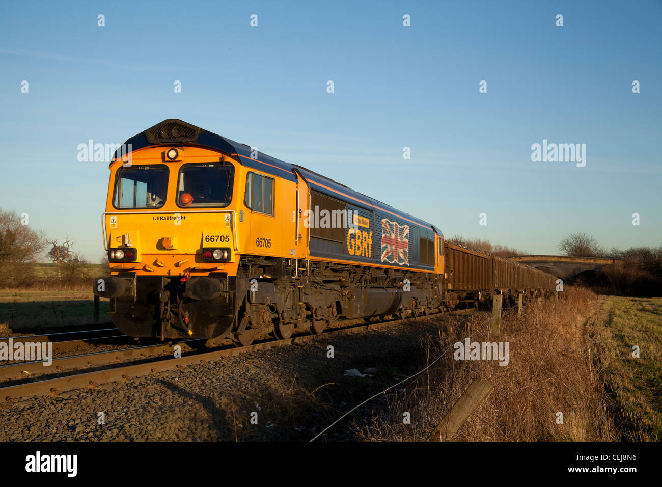 GB Rail Freight Union Jack adorned 66705 awaits a path from Stenson Junction, Derby with a scrap metals train for Cardiff Tidal Stock Photo