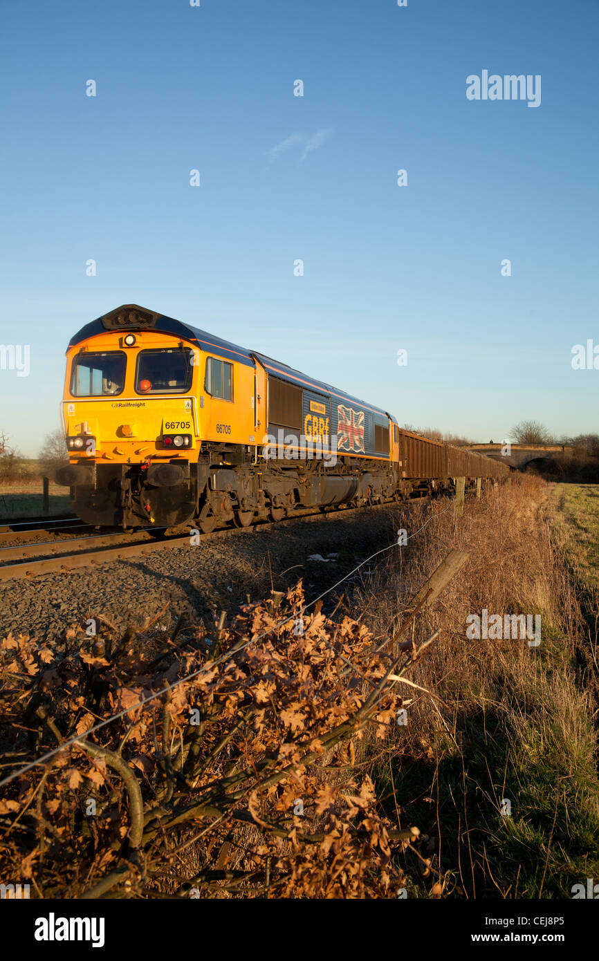 GB Rail Freight Union Jack adorned 66705 awaits a path from Stenson Junction, Derby with a scrap metals train for Cardiff Tidal Stock Photo