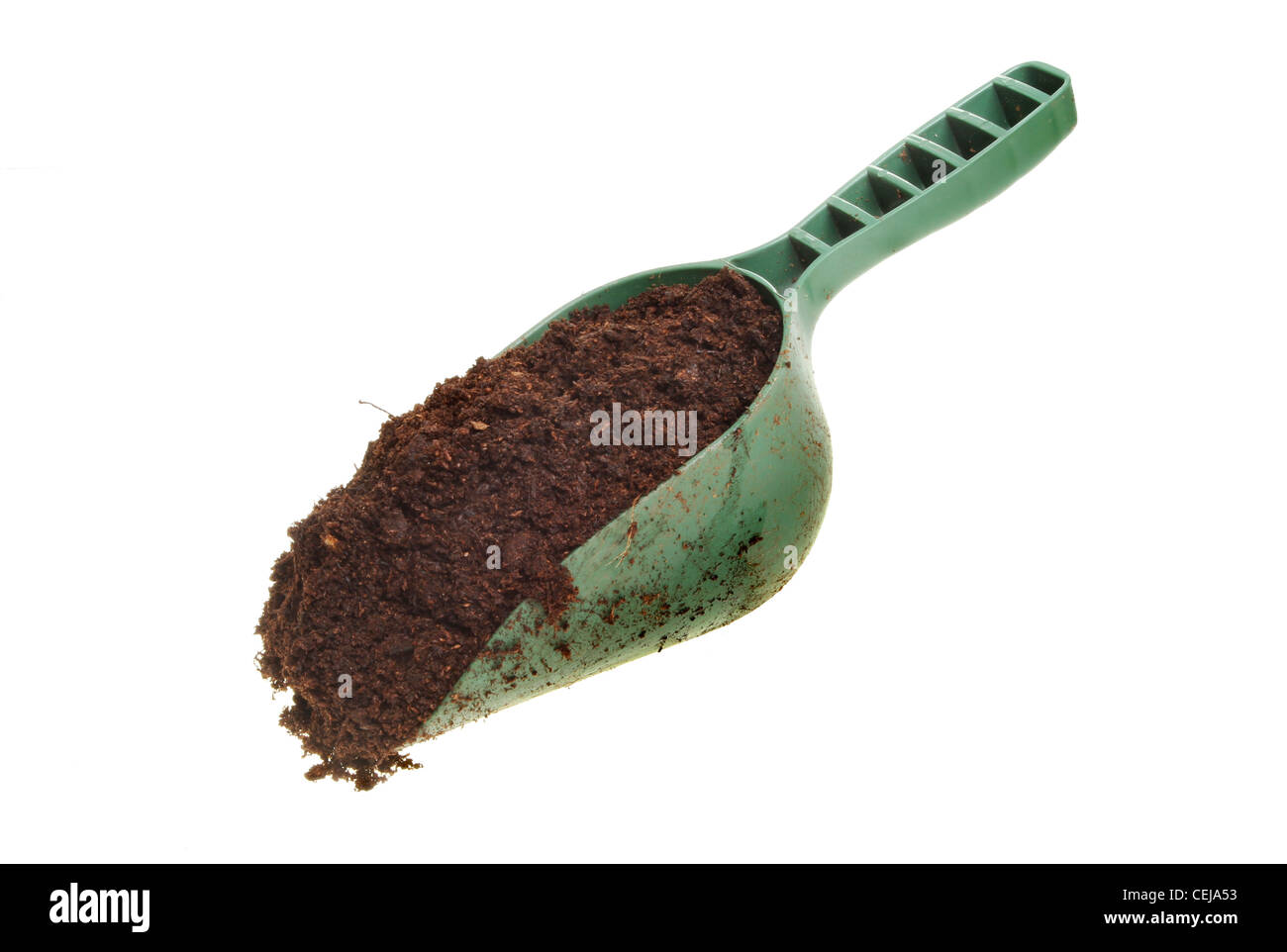 Garden compost in a plastic scoop isolated against white Stock Photo