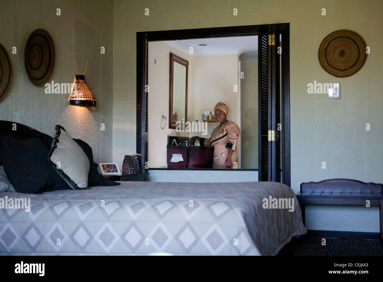 Maid tidying room at Bakubang Safari Lodge,Pilanesberg Game Reserve,North West Province Stock Photo