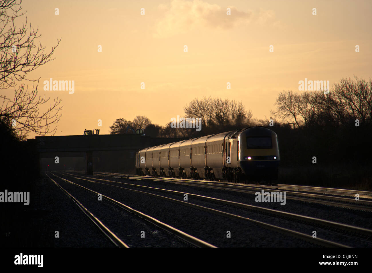 High speed train and illuminated rail's Cossington foot crossing, Cossington, Leicestershire. Stock Photo