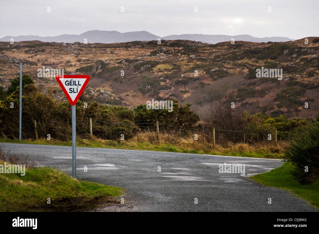 Gaeltacht roadsign in Gaelic Irish language region meaning Give Way Stock Photo