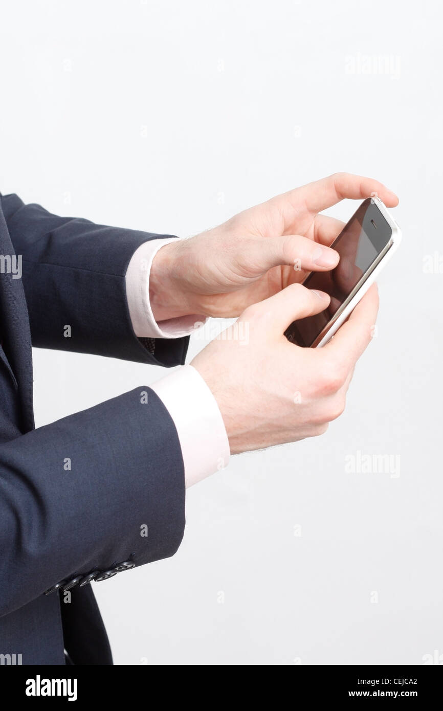 A business man typing on cell phone Stock Photo