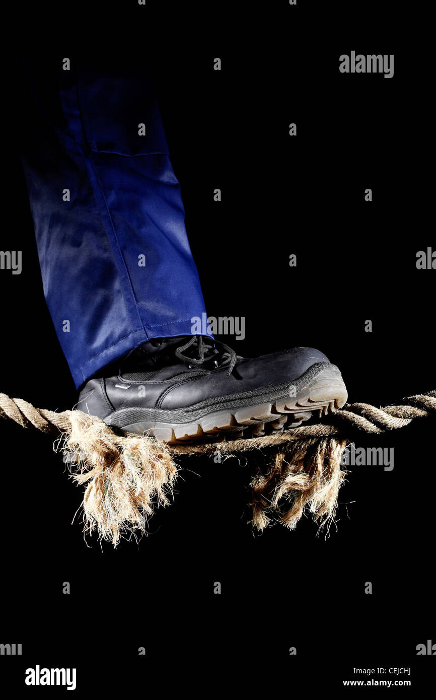 Hanging by a thread - almost broken rope, frayed tensioned cord held  together by a thin string - illustration on white background Stock Photo -  Alamy