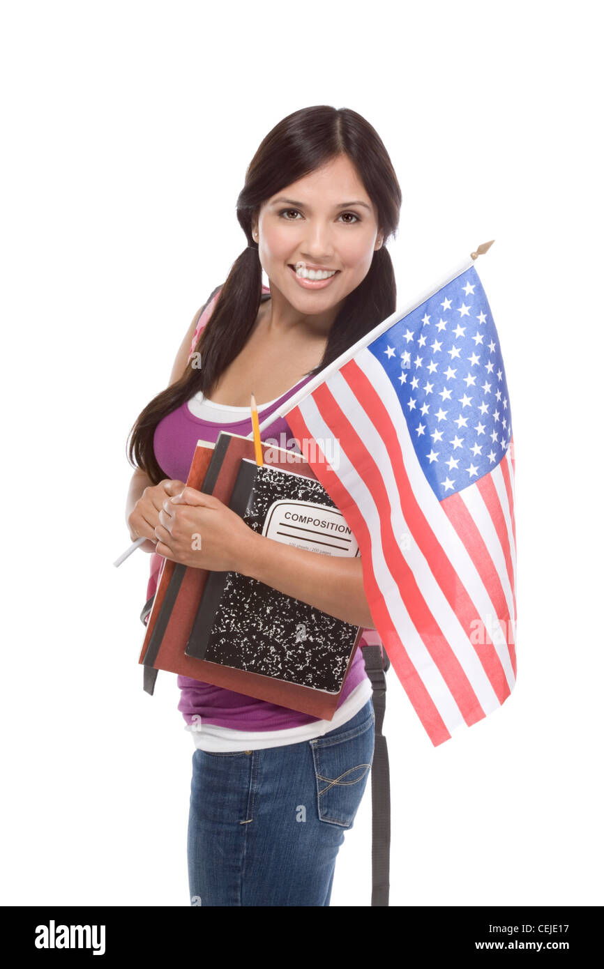 Friendly ethnic Latina woman high school student standing holding American flag Stock Photo