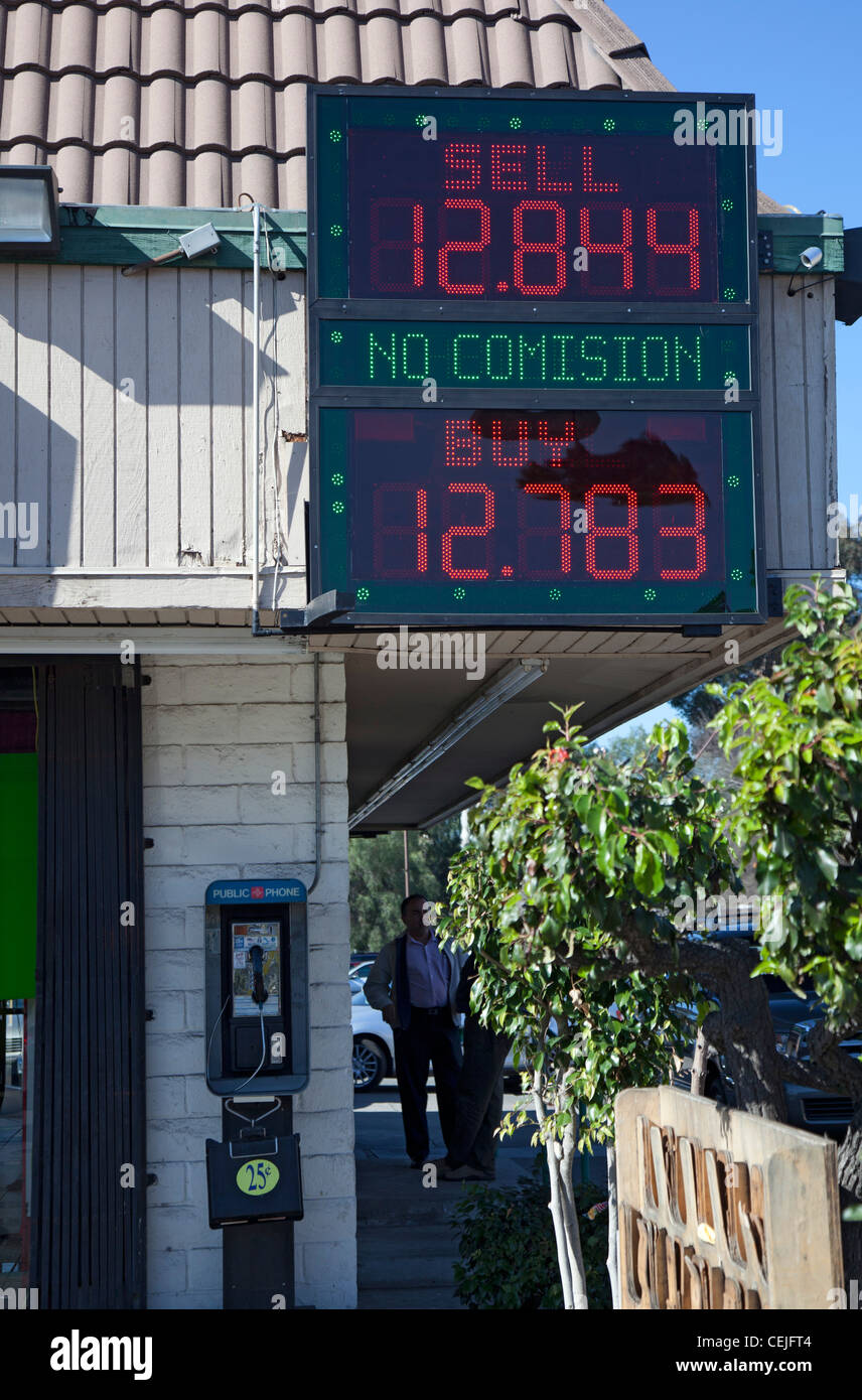 San Ysidro, California Currency exchange rates are posted at a shop