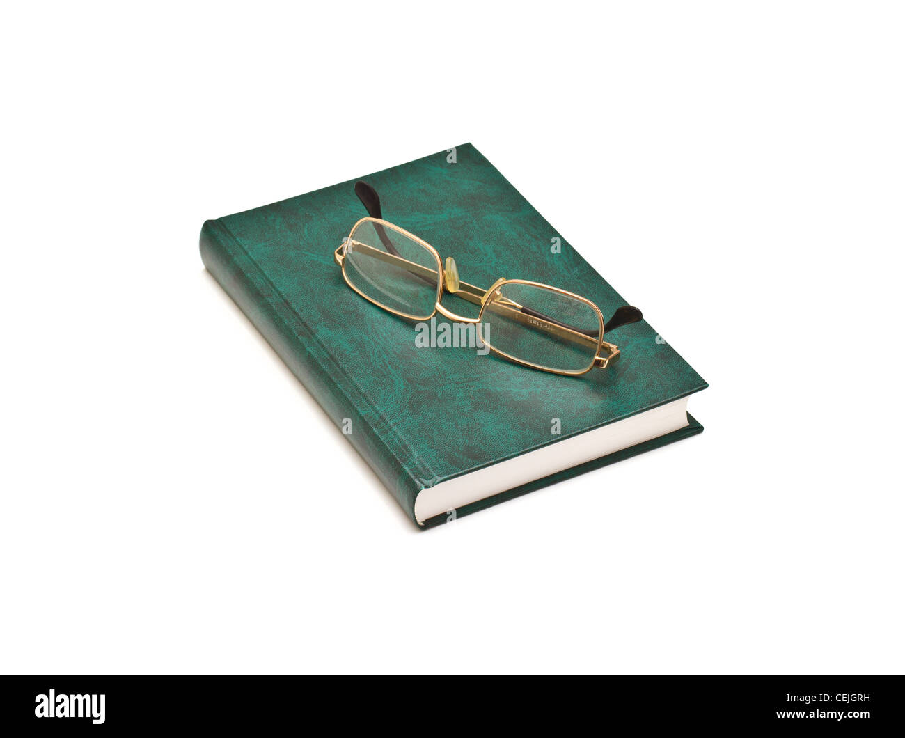 Green book and glasses, isolated on white background Stock Photo