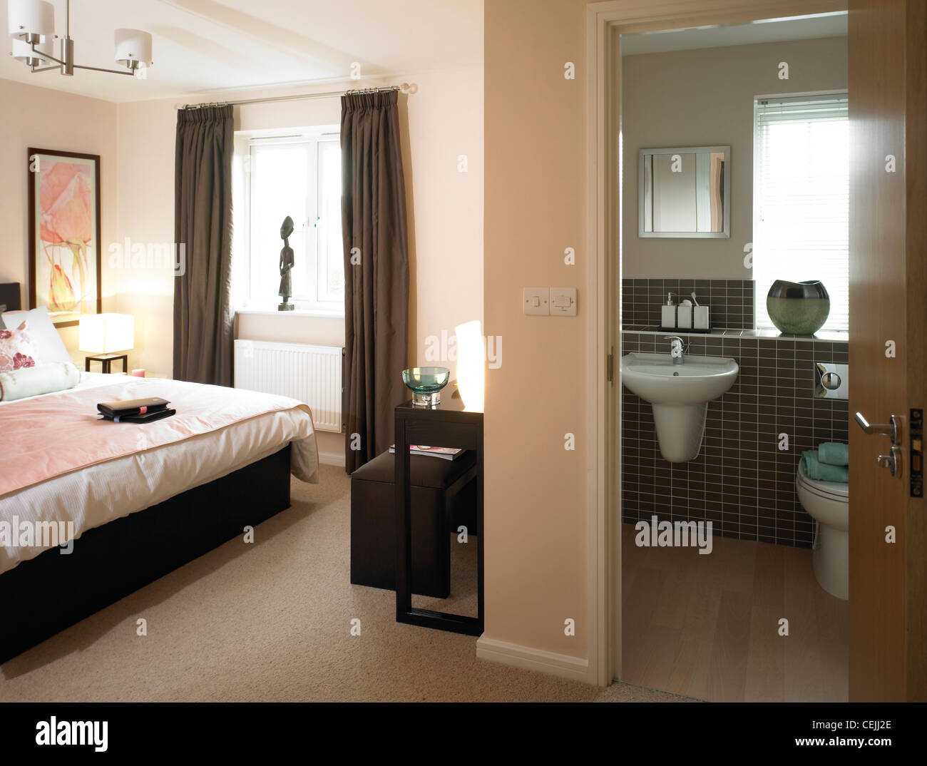 Double bedroom and en-suite bathroom. Stock Photo