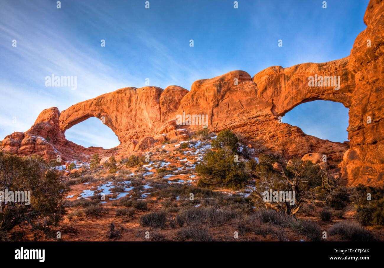The North and South Window Arches form openings in the same sandstone fin. Arches Nat'l Park. Utah Stock Photo