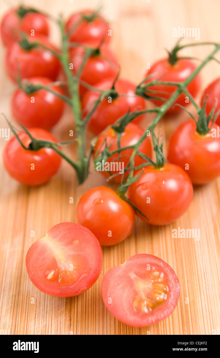 A still life image of a cherry tomatoes on the vine Stock Photo - Alamy