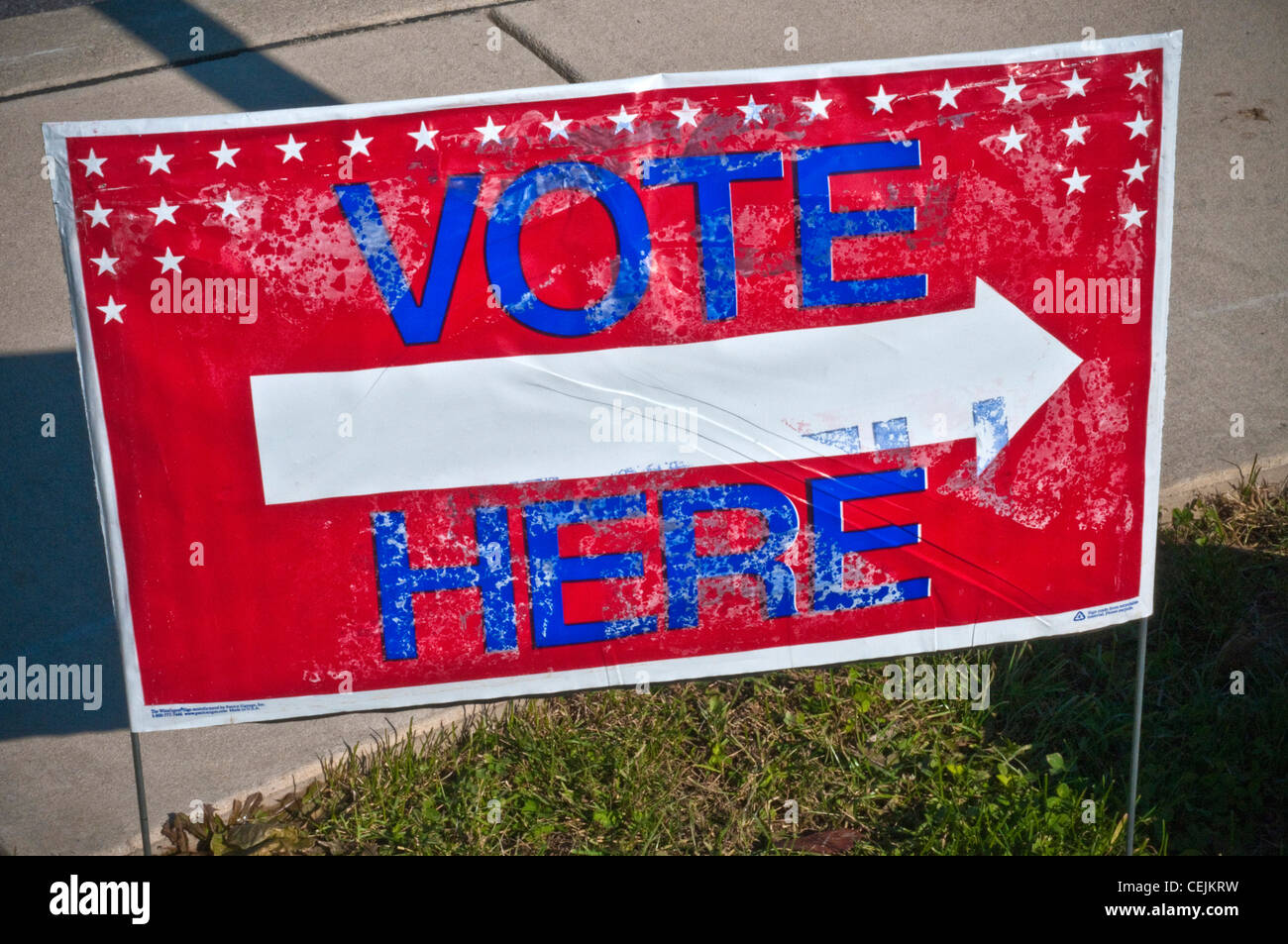 Vote here sign at local polling place Stock Photo Alamy