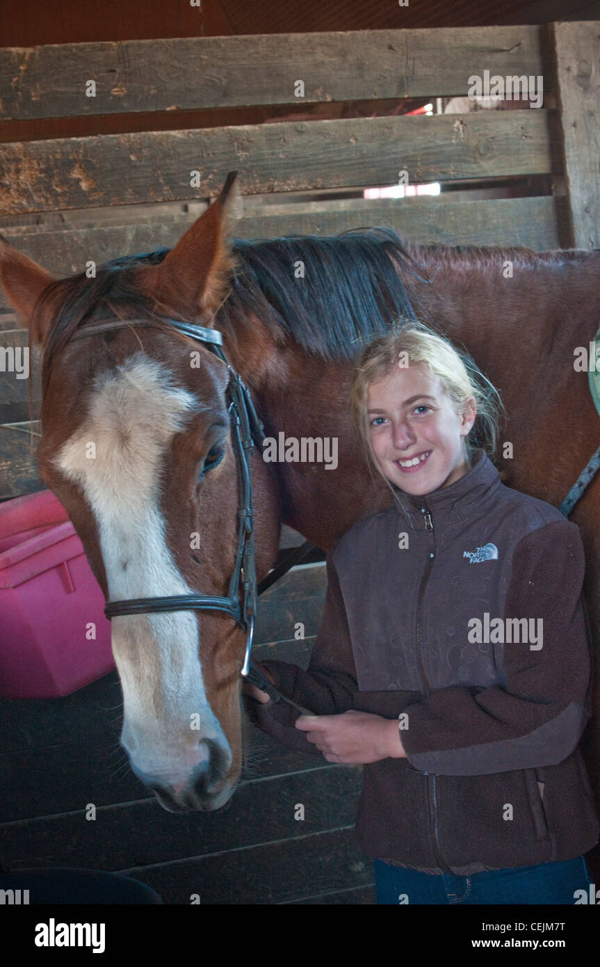 Young teen age girl with horse in stable Stock Photo - Alamy