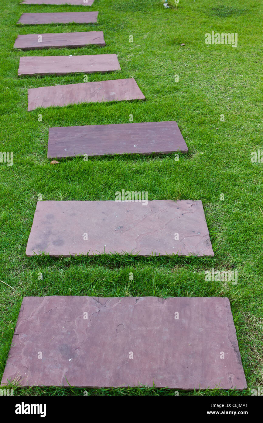 Walkway in the garden, Slab pavement on the grass Stock Photo