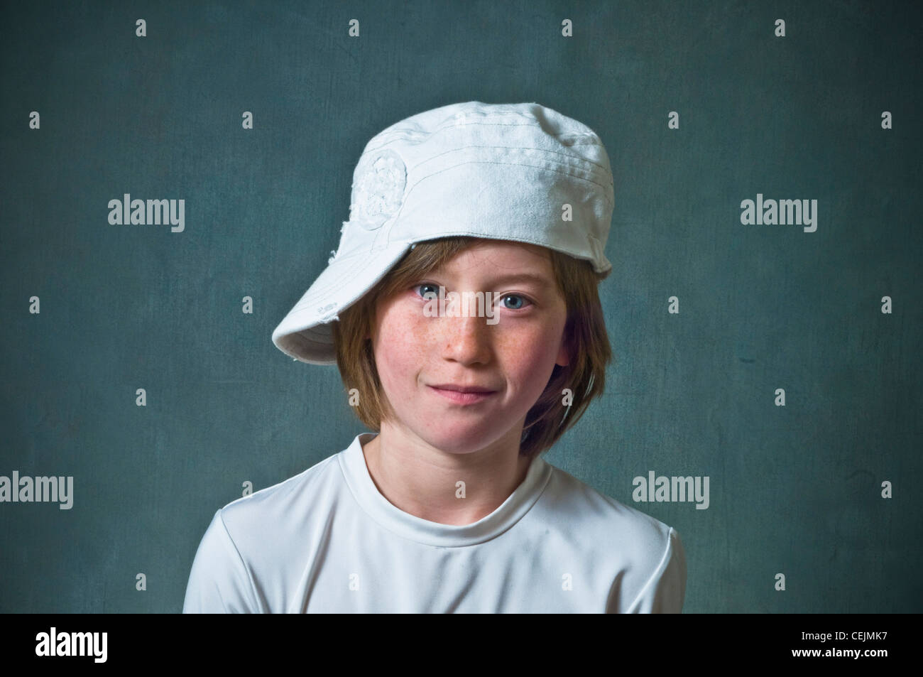 Young girl, funny face, baseball cap Stock Photo Alamy