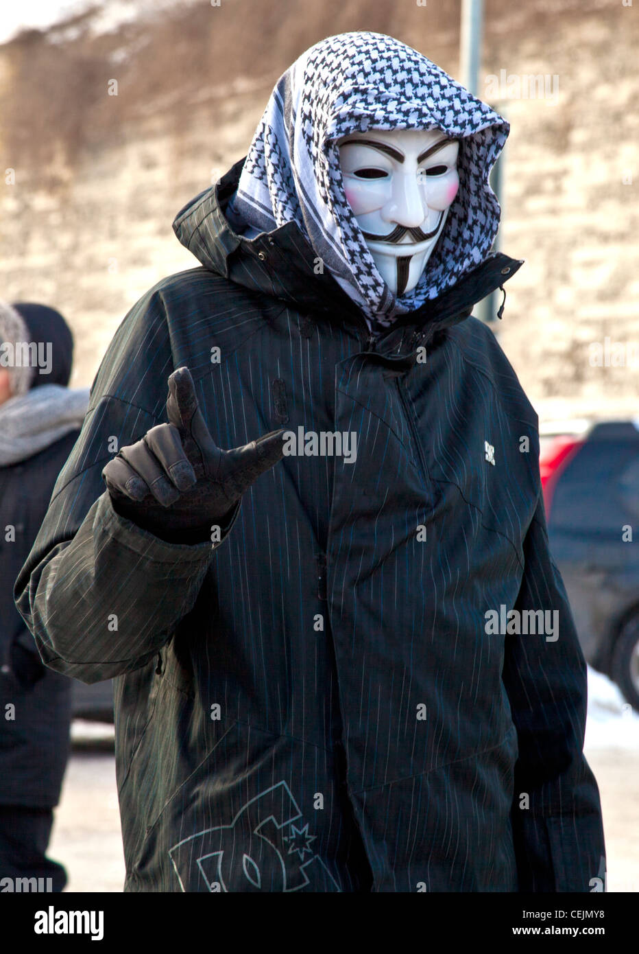 Man posing for the camera wearing a Guy Fawkes mask at the anti-ACTA protest in Tallinn, Estonia Stock Photo