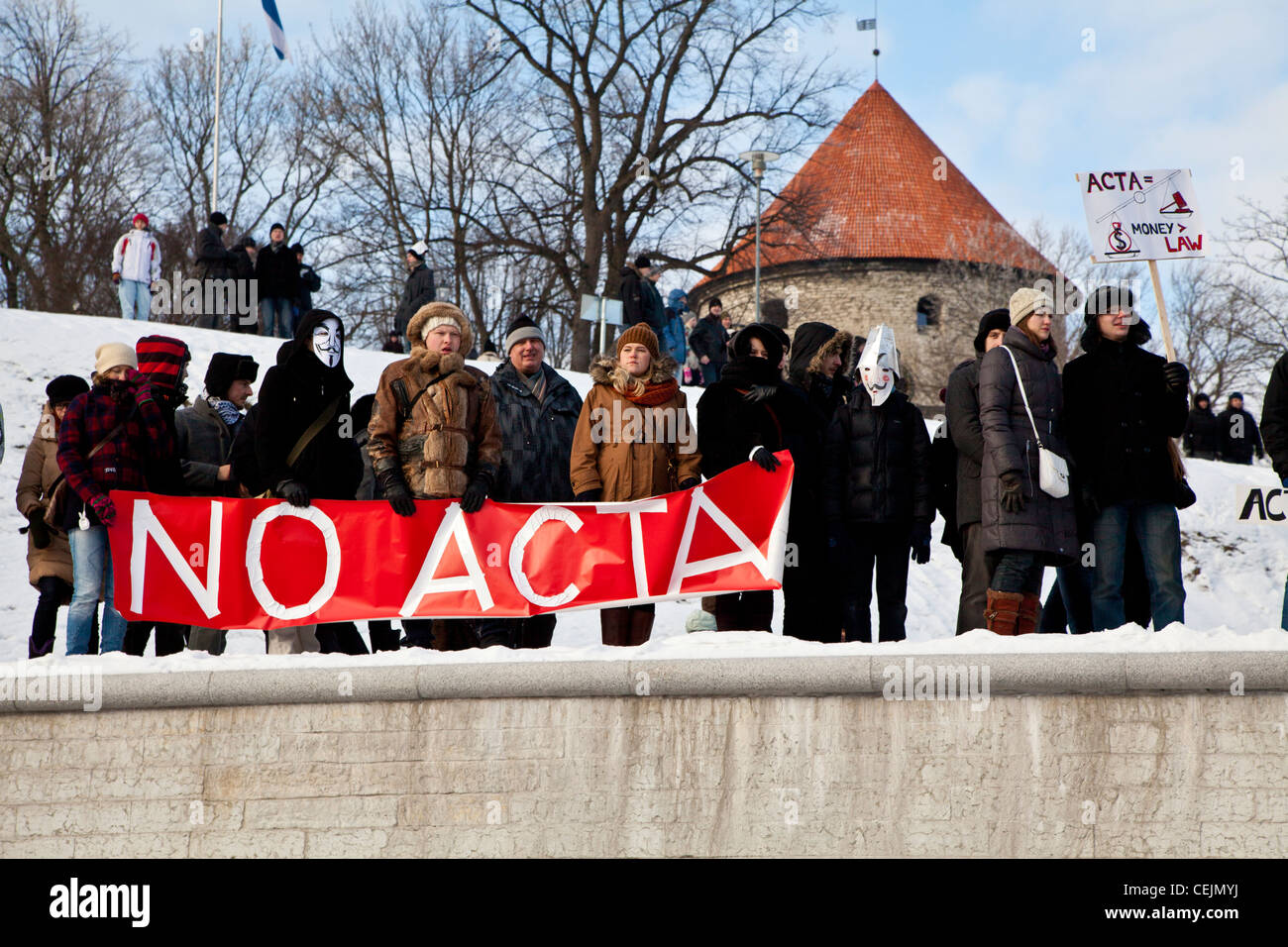 People gathered at the protest against the Anti-Counterfeiting Trade Agreement holding 'No ACTA' signs in Tallinn, Estonia Stock Photo