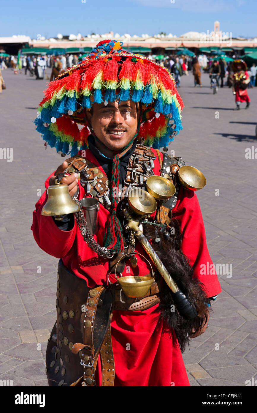 Local man posing for tourists in traditional costume, Djemaa el Fna sqare, Marrakech, Morocco, North Africa Stock Photo