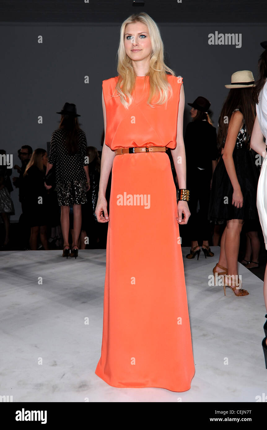 Tory Burch New York Ready to Wear Spring Summer Structured floor length  orange dress, with brown leather belt Stock Photo - Alamy