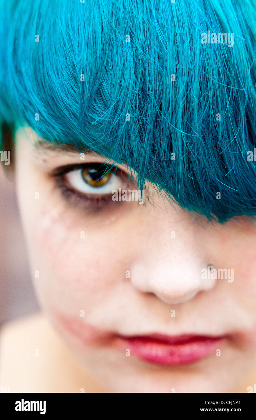 Portrait of a young woman with make-up like The Joker's with turquoise hair Stock Photo