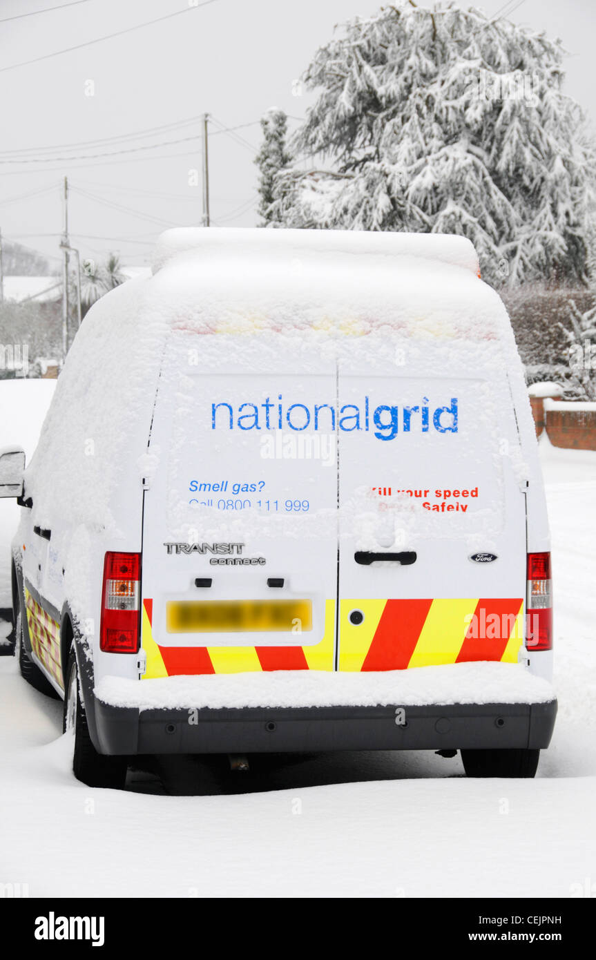 National Grid snow covered gas van parked in residential street Stock Photo