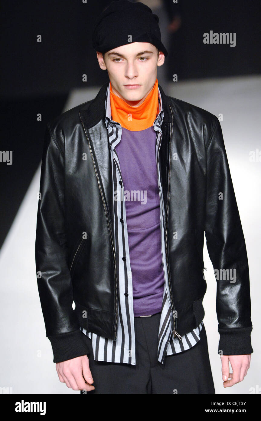 Agnes B Ready to Wear Menswear Paris A W Male model black leather jacket over a black and white striped button down shirt Stock Photo Alamy