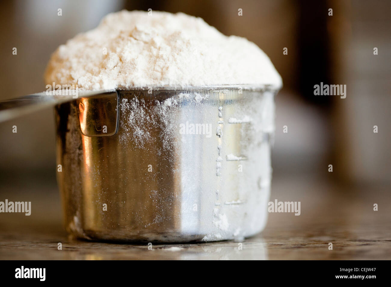 Flour in measuring cup Stock Photo