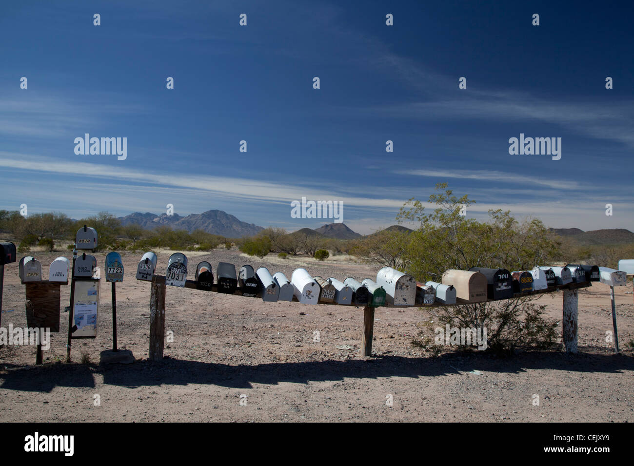 Three Pointes, Arizona - A long row of mailboxes are lined up along a dirt road in the desert west of Tucson. Stock Photo