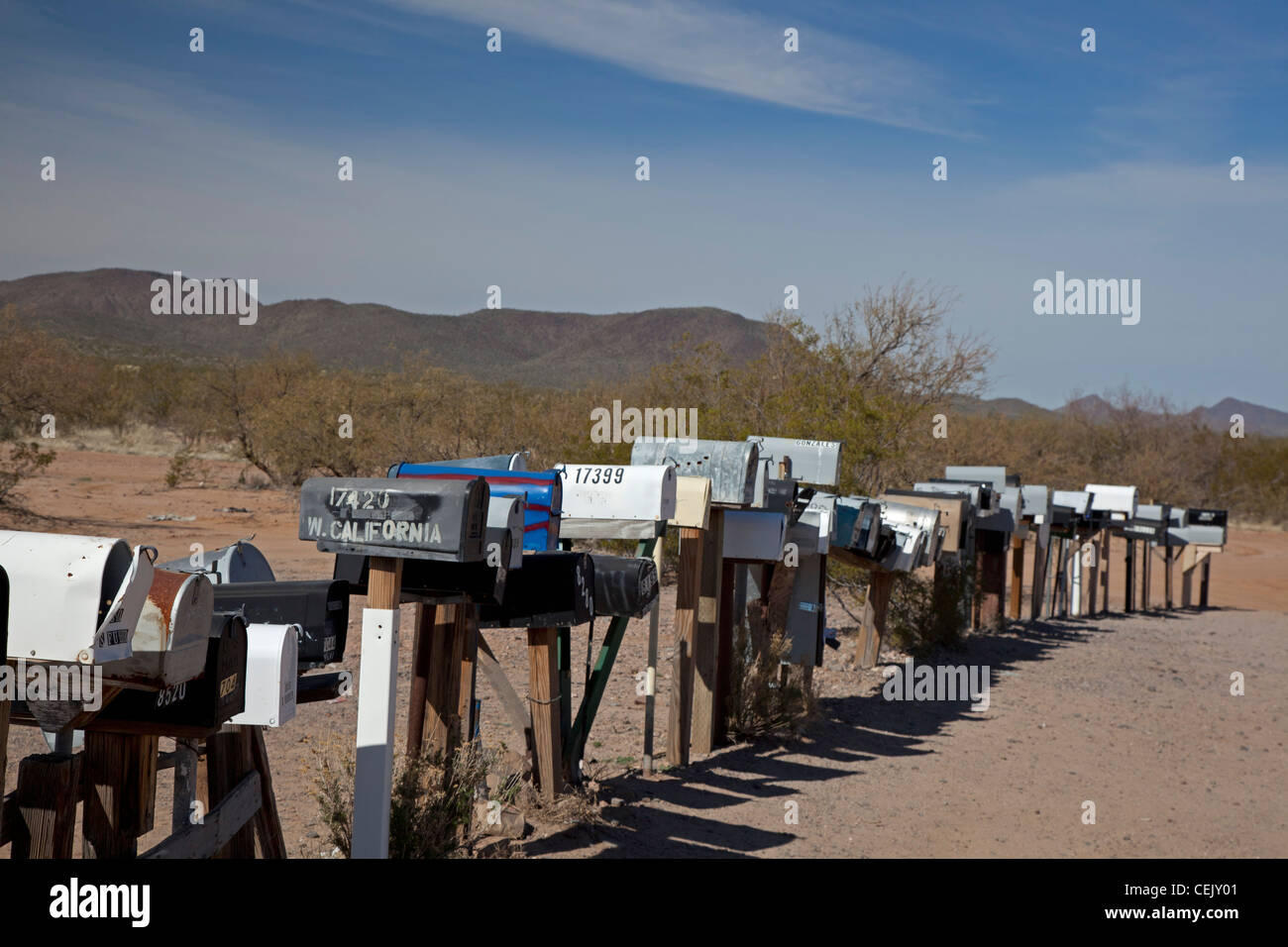 Three Pointes, Arizona - A long row of mailboxes are lined up along a dirt road in the desert west of Tucson. Stock Photo