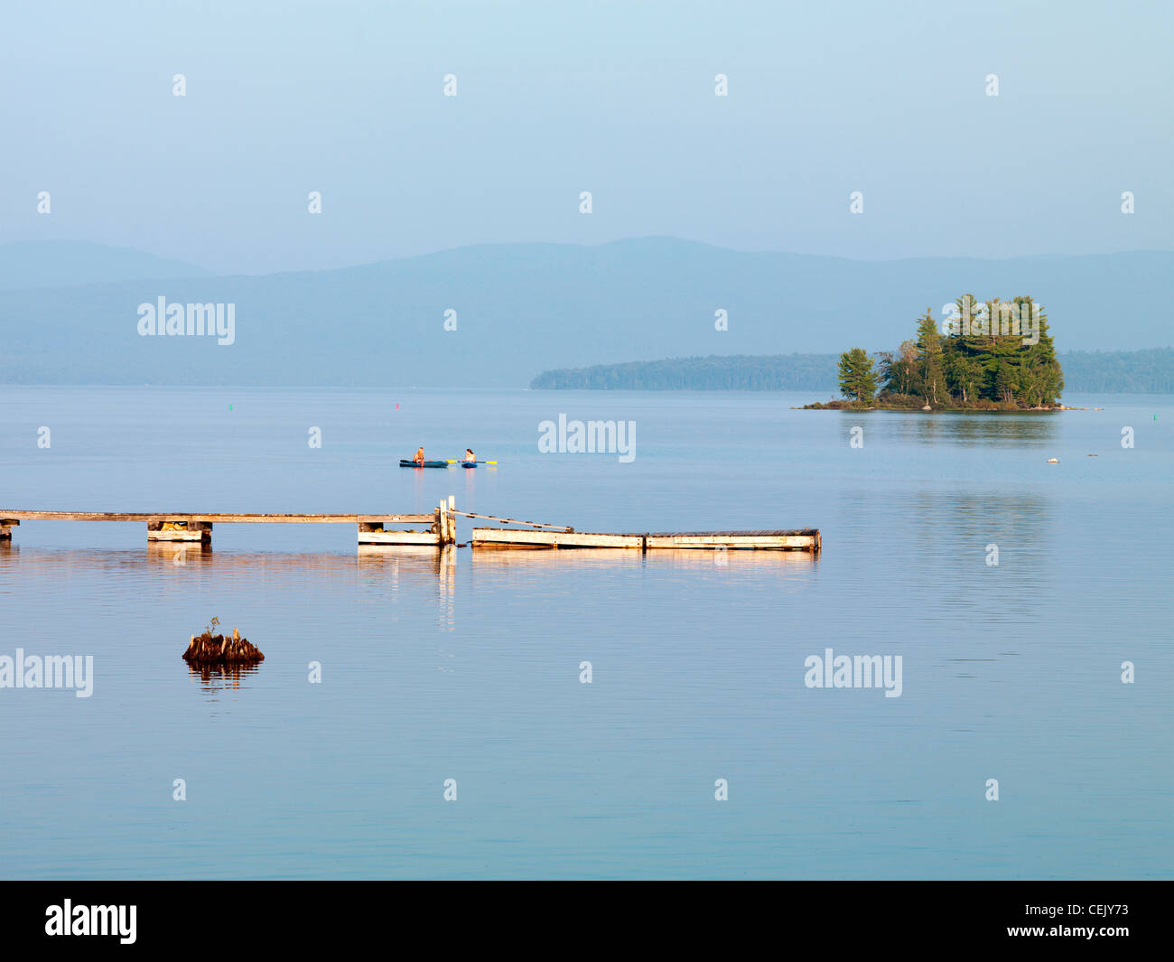Kayakers rest near the dock at Upper Dam on Mooselookmeguntic Lake in