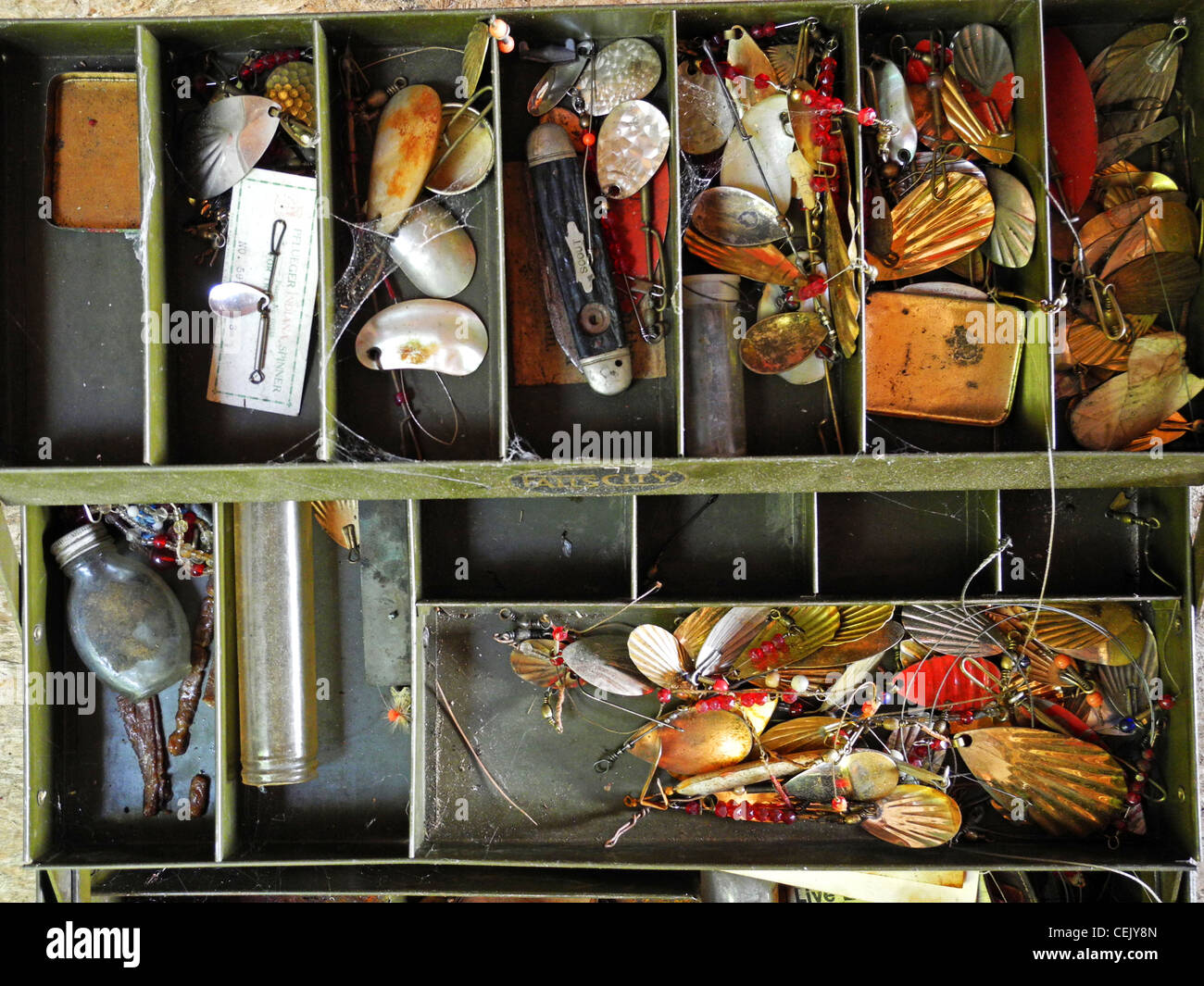 Old fishing tackle box is filled with lures from bygone days in the