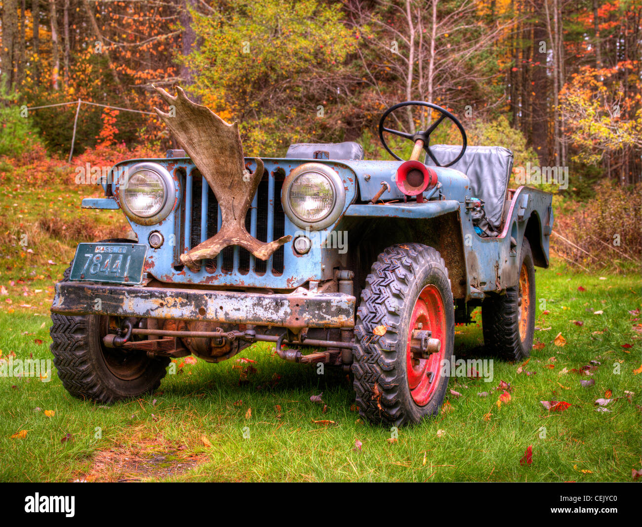 A vintage jeep awaits a task at a historic hunting and fishing camp on the Narrows of Richardson Lake in western Maine. Stock Photo