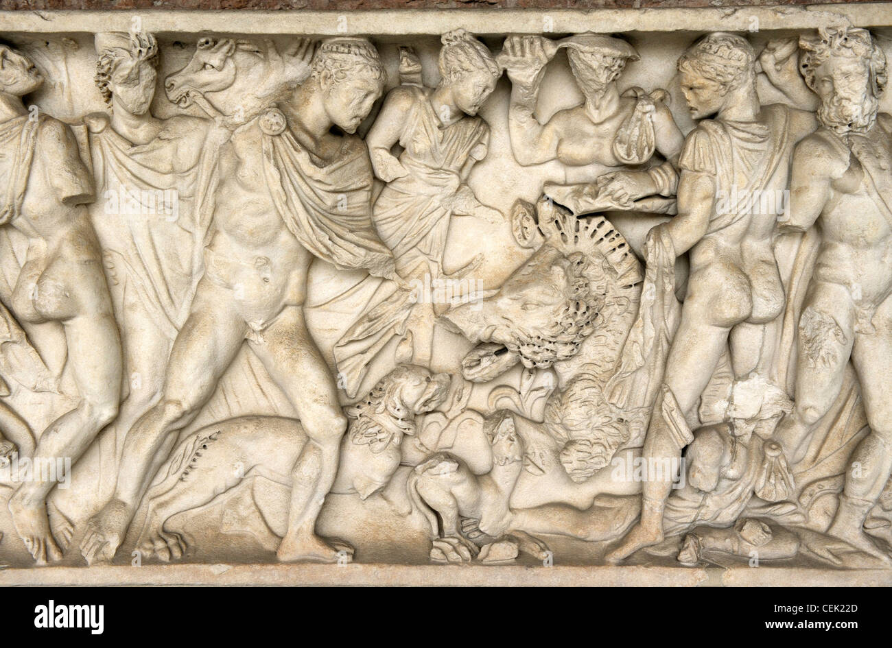 Roman period carved stone relief sarcophagus panel inside the Camposanto Monumentale cemetery. Pisa, Tuscany, Italy. Boar hunt Stock Photo
