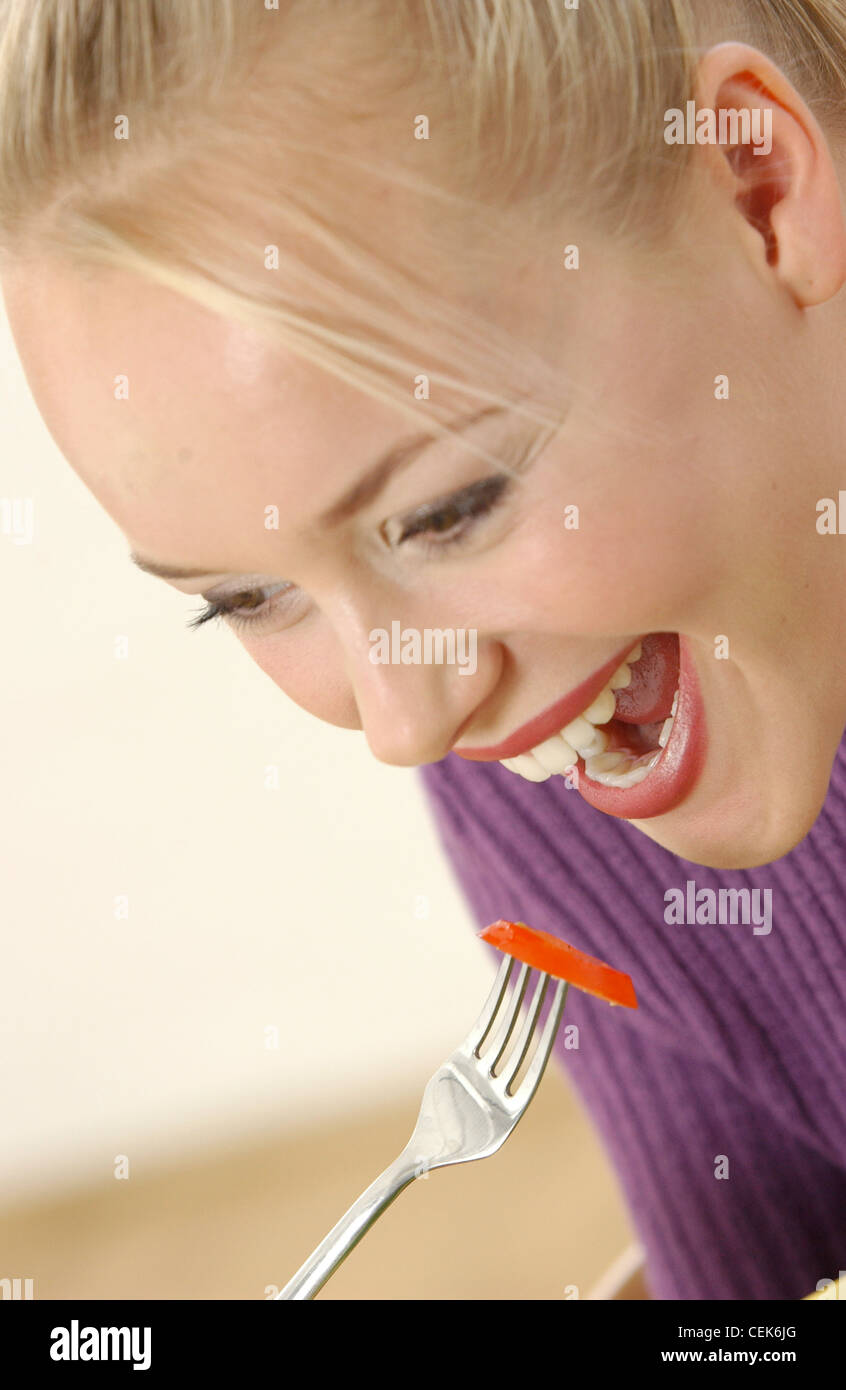Female Blonde Hair Up Off Face Strands Of Fringe On Forehead
