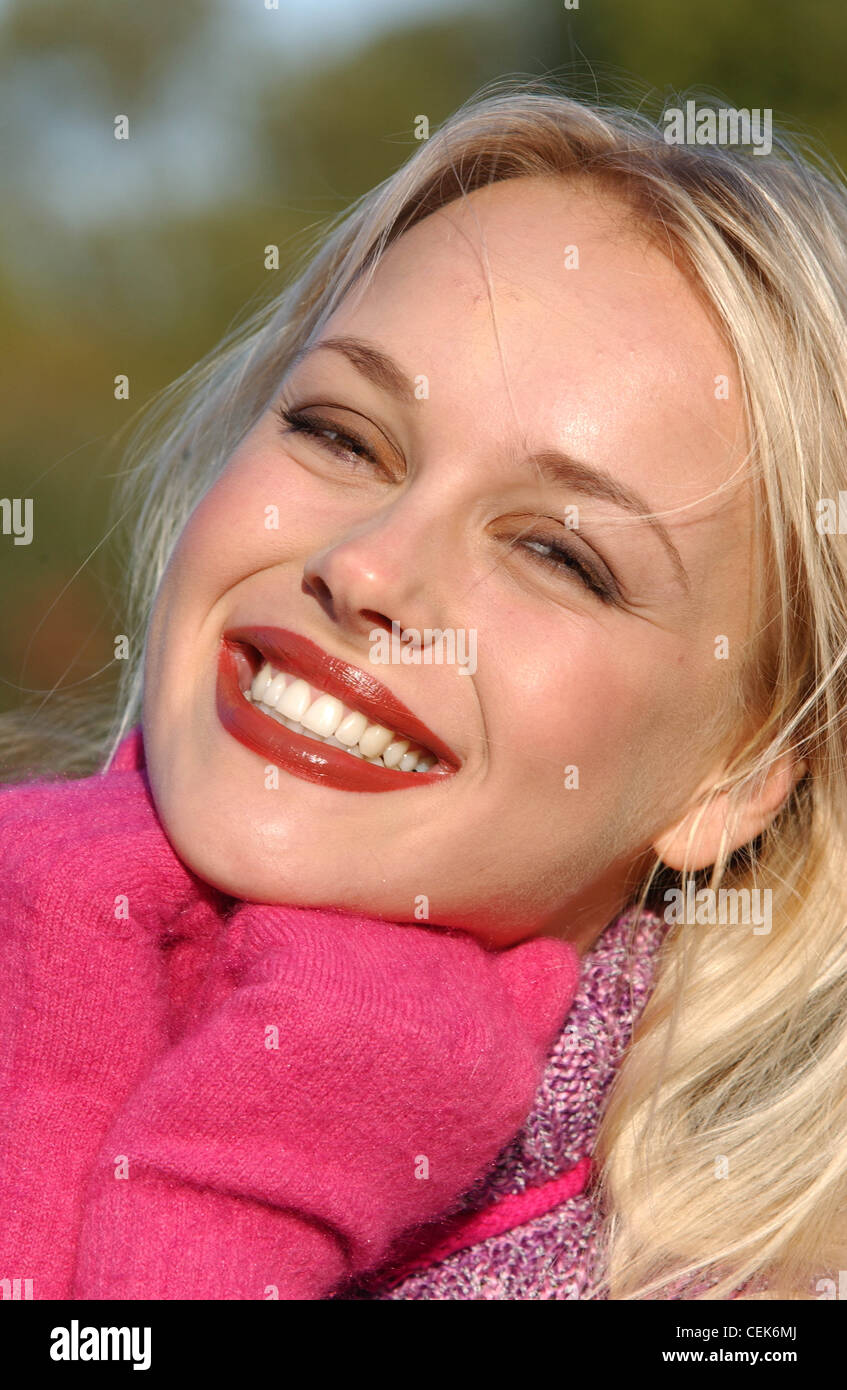Female Long Blonde Hair Brown Tones Of Make Up Wearing Purple