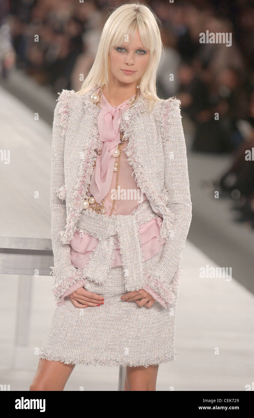 Chanel Paris Ready to Wear Spring Summer Model Dewi long blonde hair fringe  red nail polish and gold chain necklace various Stock Photo - Alamy