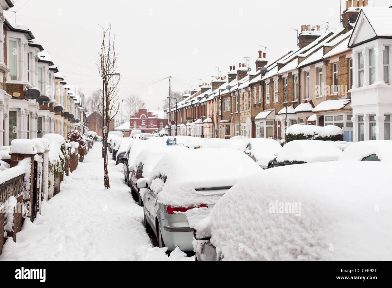 A snowy winter day in a suburban London street, England Stock Photo