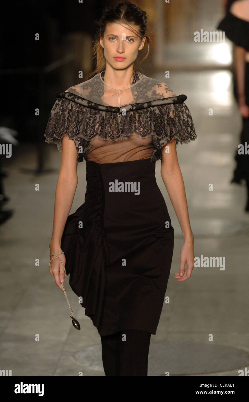 Anne Valerie Hash Paris Haute Couture Spring Summer Knee length black ruched dress with chiffon and lace cape Stock Photo