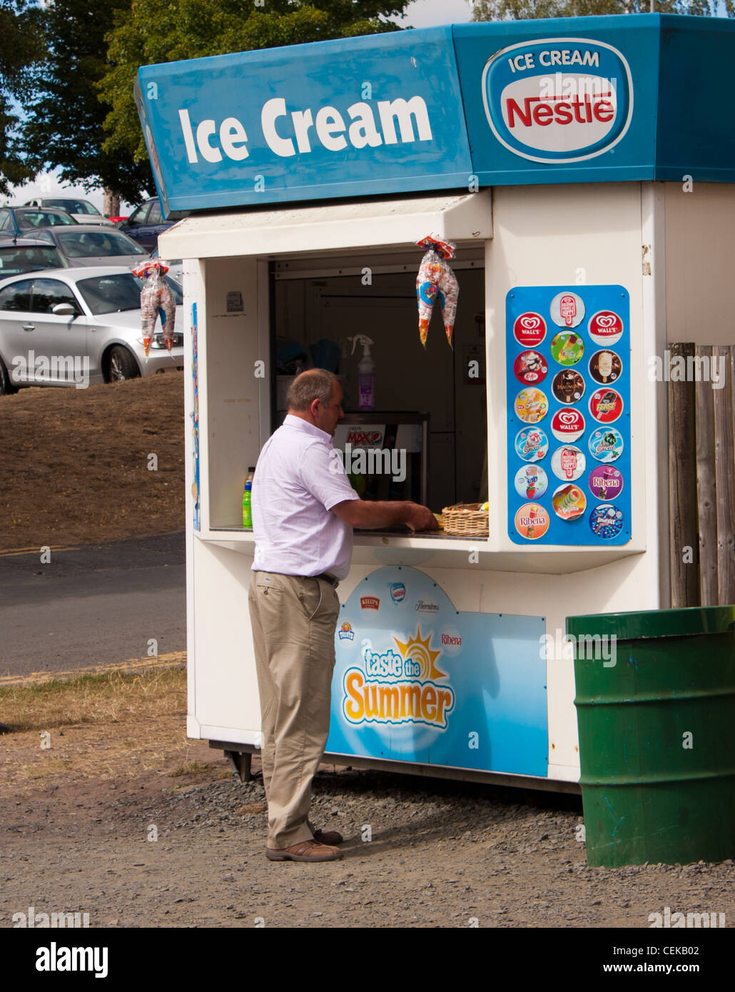An icecream kiosk near the seaside perfect for buying icecreams in the summer sun while on a family holiday Stock Photo