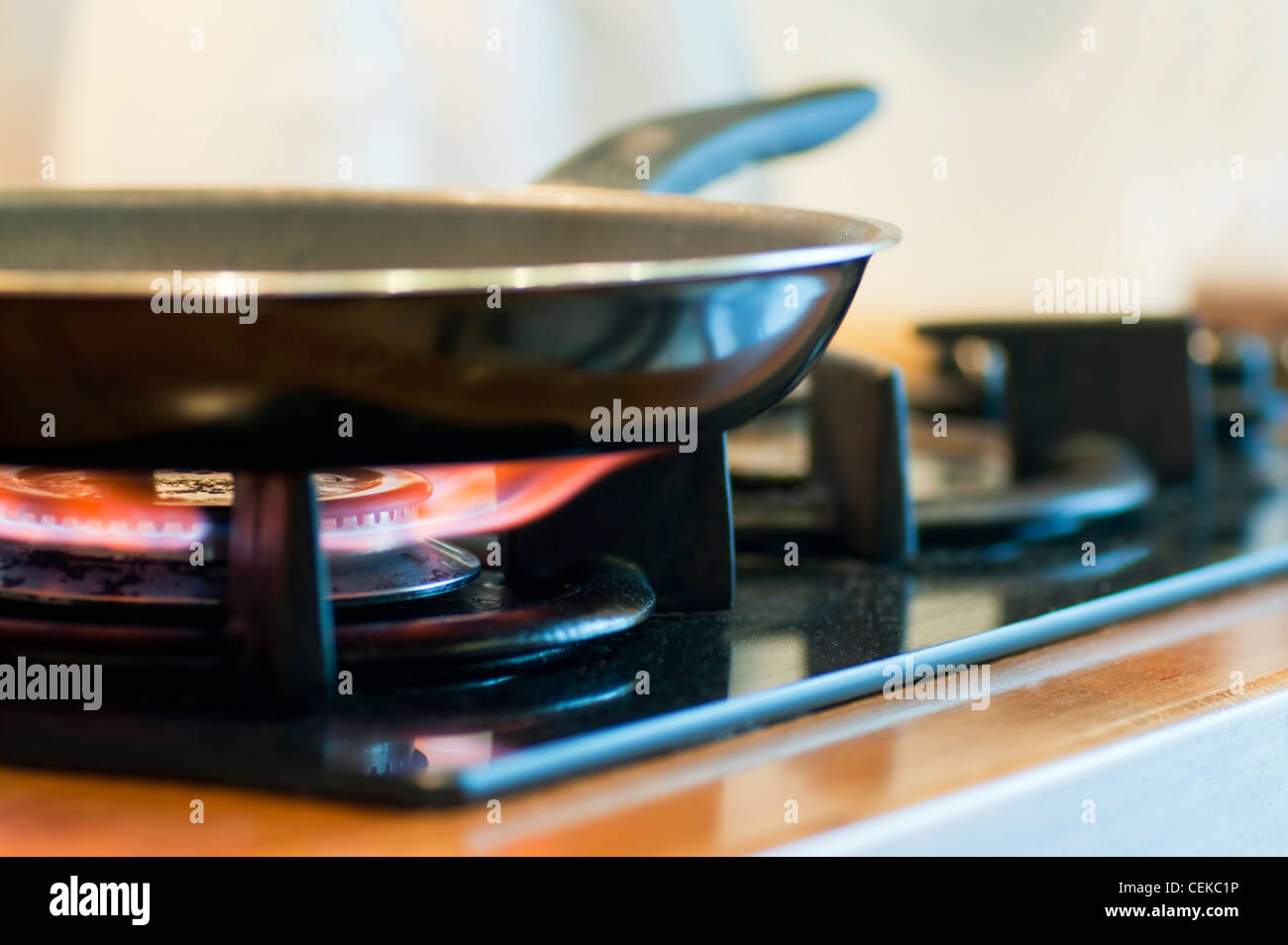 A gas cooker with frying pan on Stock Photo