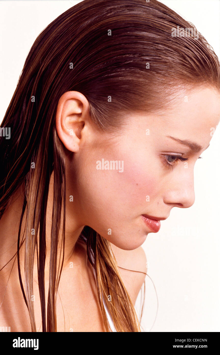 Profile Of Female With Long Wet Dark Blonde Hair Looking Down