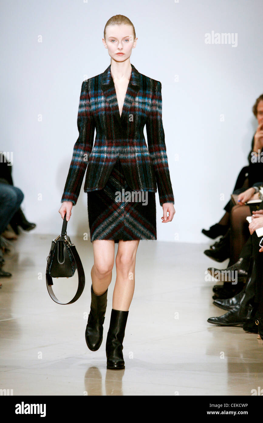 Jil Sander Milan Ready to Wear Autumn Winter Checked tweed jacket, matching  pencil skirt, black ankle boots and black handbag Stock Photo - Alamy