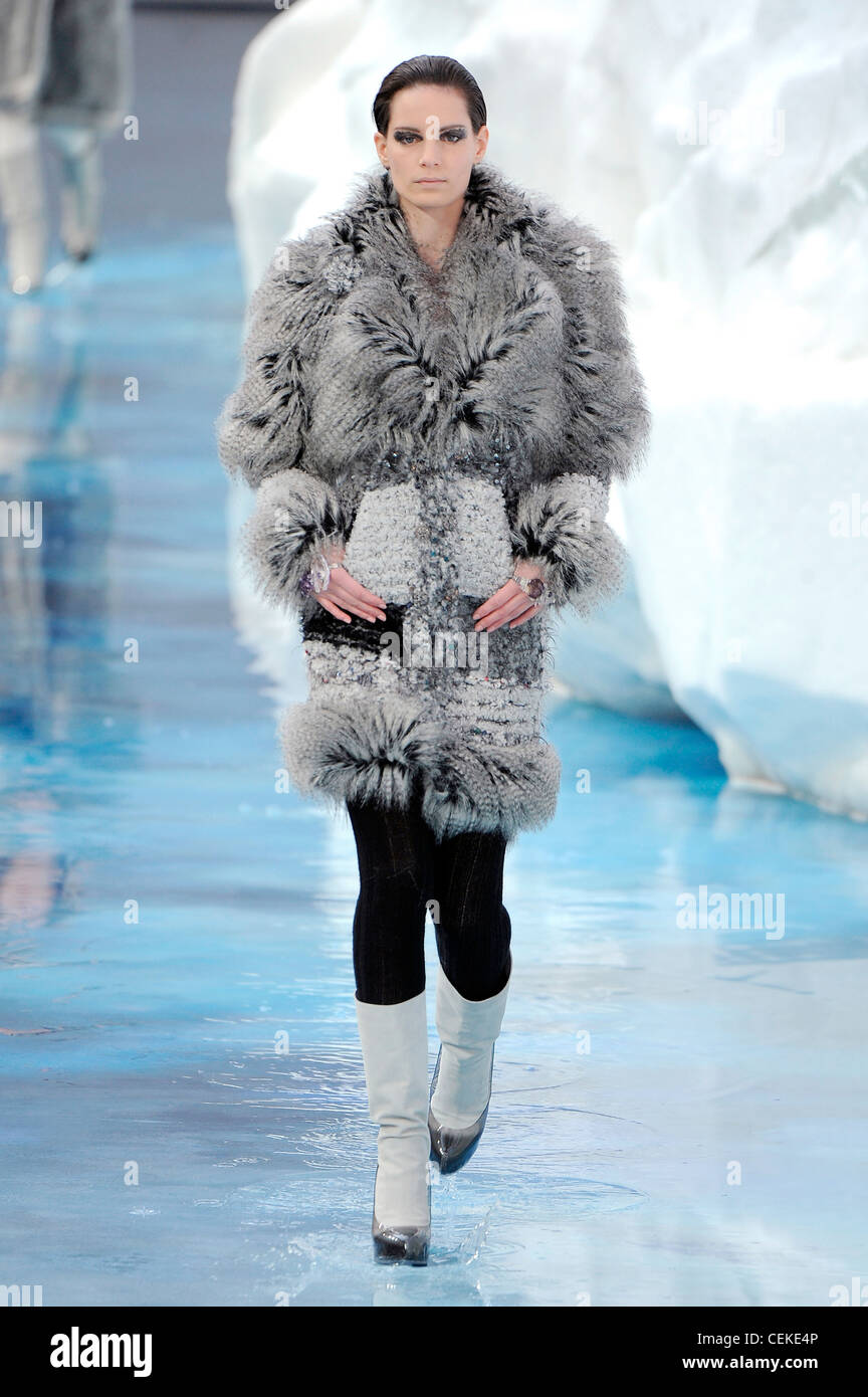 Chanel Paris Ready to Wear Autumn Winter Grey faux fur coat, black  tightsand white boots Stock Photo - Alamy